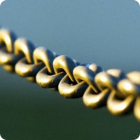 Relationships session icon: Close-up shot of links on metal chain