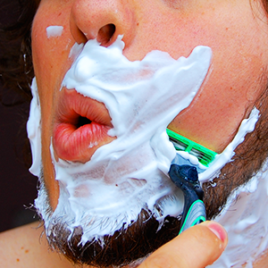 Man shaving face