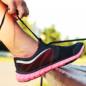 Person tying a running shoe