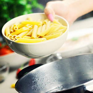 Bowl of pasta over a pan