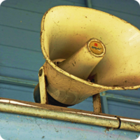 Sharing Your Story session icon: Old loudspeaker on a building