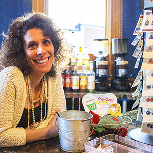 A woman smiling in a shop