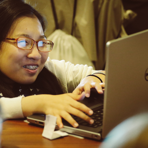 Woman typing on laptop