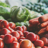 Eating Well session icon: Tomatoes, carrots, and greens are arranged together.