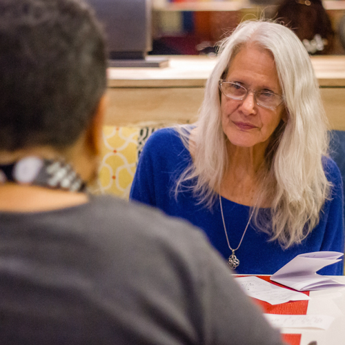 Women talking across a table