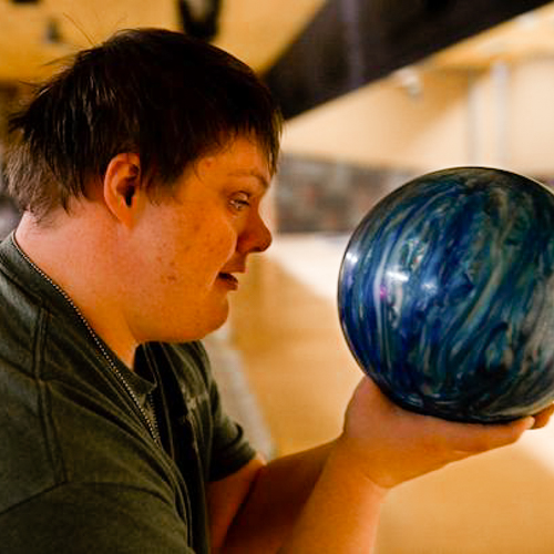 Young man bowling