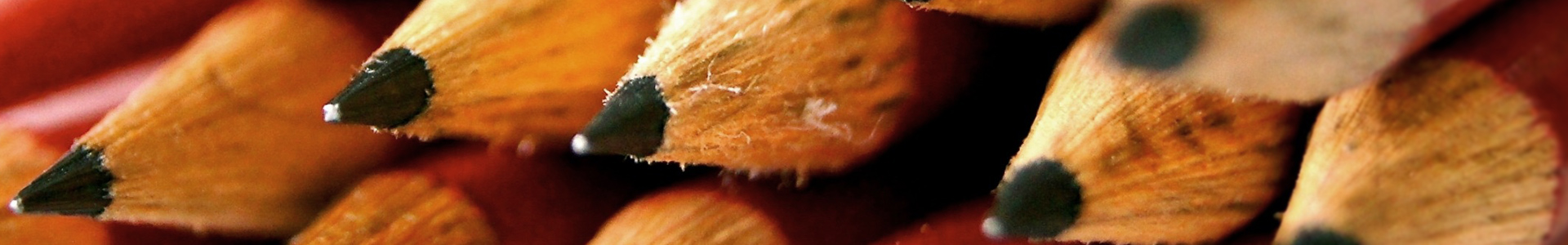 (Session Header Image): Close-up of the graphite tips of stacked, sharpened pencils