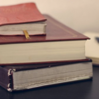 Seeking Information session icon: Stack of three hardback books