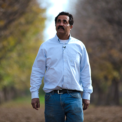 Man walking down the road looking upwards